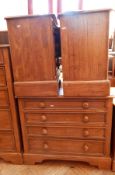 A modern hardwood pair of three drawer bedside cupboards,
