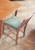 A set of four oak dining chairs with moulded splats, upholstered drop-in seats,