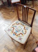 A mahogany dining chair with upholstered seat,