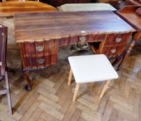 A Chippendale style hardwood dressing table with wavy moulded edged border and serpentine drawer