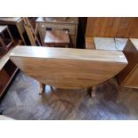 Ercol style elm drop-leaf dining table,
