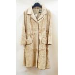 A goat/pony skin(?) vintage 1960's coat trimmed with leather  Live Bidding: If you would like a