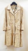 A goat/pony skin(?) vintage 1960's coat trimmed with leather  Live Bidding: If you would like a