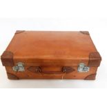 A hide suitcase with reinforced corners and chrome mounts, initialled "HIP"  Live Bidding: If you