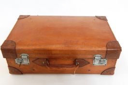 A hide suitcase with reinforced corners and chrome mounts, initialled "HIP"  Live Bidding: If you
