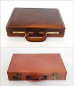 A leather suitcase with brass fittings and a brown leather attache case by Mendoza (2)  Live