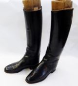 Pair of gentleman's black leather hunting boots with fitted wooded trees and back protector (