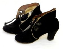 A pair of vintage black suede lace up ankle boots with stack heel