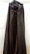 Saint Laurent Rive Gauche heavy woollen cloak, eastern style with hood having tassel and trimmed