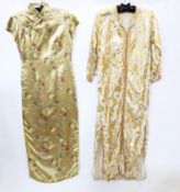 A gold-coloured satin cheongsam, full length short sleeves with frogging fastenings and a cream silk