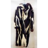 A full-length skunk fur coat  Live Bidding: If you would like a condition report on this lot, please