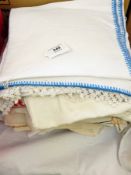 A large quantity of table linen including embroidered, crochet edged, table napkins, tablecloths,