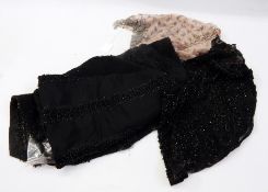 Heavily black beaded pieces, possibly from a skirt with an organza sleeveless top, heavily