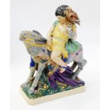 Charles Vyse glazed earthenware group, "The Falconer", boy seated on donkey carrying eagle and