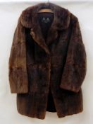 A vintage musquash fur coat carrying label "Calman Links,