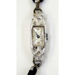 Lady's Art Deco style platinum and diamond set cocktail watch with rectangular dial, button