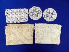 A selection of lace, lace collars and others including tablecloths, table mats, a cobweb christening