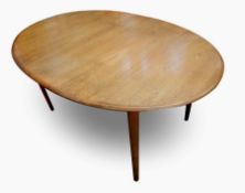 1970s stained wood oval dining table, with two extra leaves  Live Bidding: If you would like a