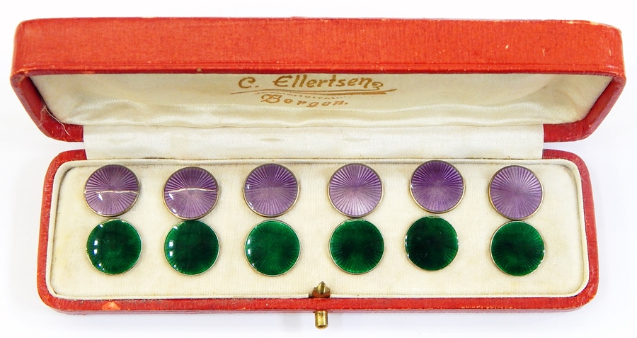 Two sets of six Norwegian silver-gilt and enamel buttons, one set with purple enamel and the other