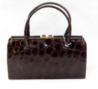 1950's brown crocodile handbag, fixed frame, suede lined interior, labled "The Martin, made in