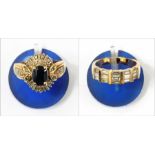 Gold-coloured metal ring set with baguette diamonds and a gold, sapphire and diamond cluster ring (