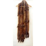 A mink stole with tails  Live Bidding: If you would like a condition report on this