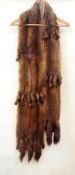 A mink stole with tails  Live Bidding: If you would like a condition report on this