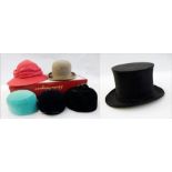 A midnight blue velvet Christian Dior pillbox hat with hat pin, similar in black and another in