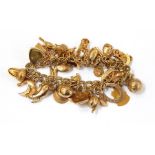 9ct gold charm bracelet having padlock clasp together with 27 various charms Live Bidding: If you
