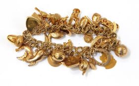 9ct gold charm bracelet having padlock clasp together with 27 various charms Live Bidding: If you