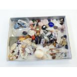 A collection of precious stones and costume jewellery, polished hardstones, agates, onyx, etc.