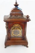 Victorian mahogany mantel clock in basket-top case with broken arch dial,