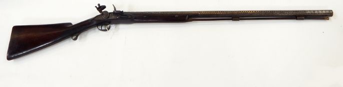 A 19th century flintlock musket with octagonal barrel, floral engraving, with East India Company