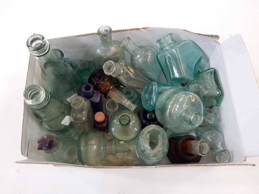 A collection of glass bottles to include Drew & Co,