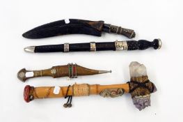 A collection of daggers including a Jambiya and others