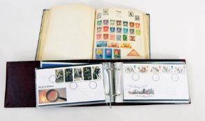 Blue album of world stamps and two albums of Royal Mail first day covers