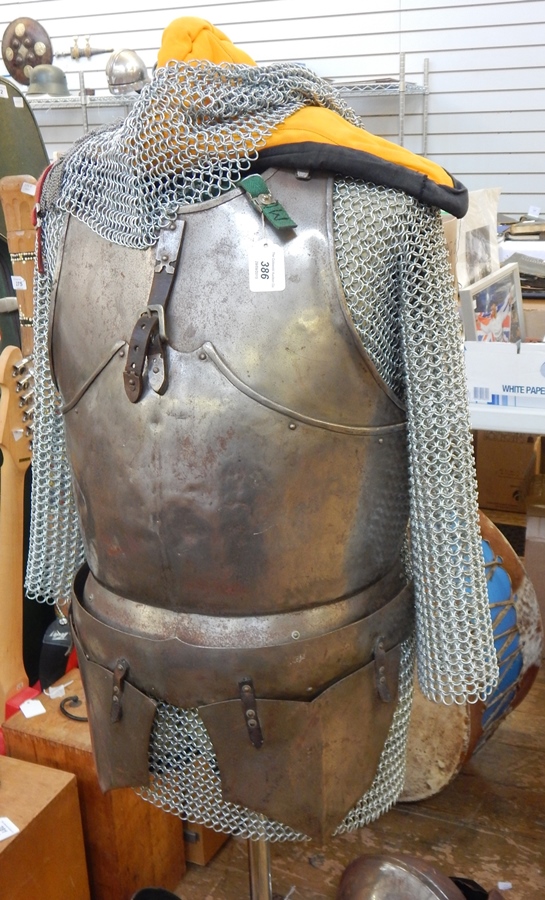Steel and chain-mail suit of armour by Terry English viz:- breastplate, helmet,