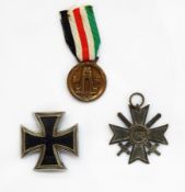 Two German Iron crosses and a German/ Italian field service medal,