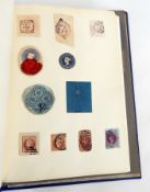 Blue album containing GB stamps,