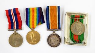 Three defence medals, one 1918-1940 with 3488 Pte W A Wilson, Glouc.