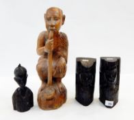 Large Nigerian carved wooden figure of seated male with pipe,