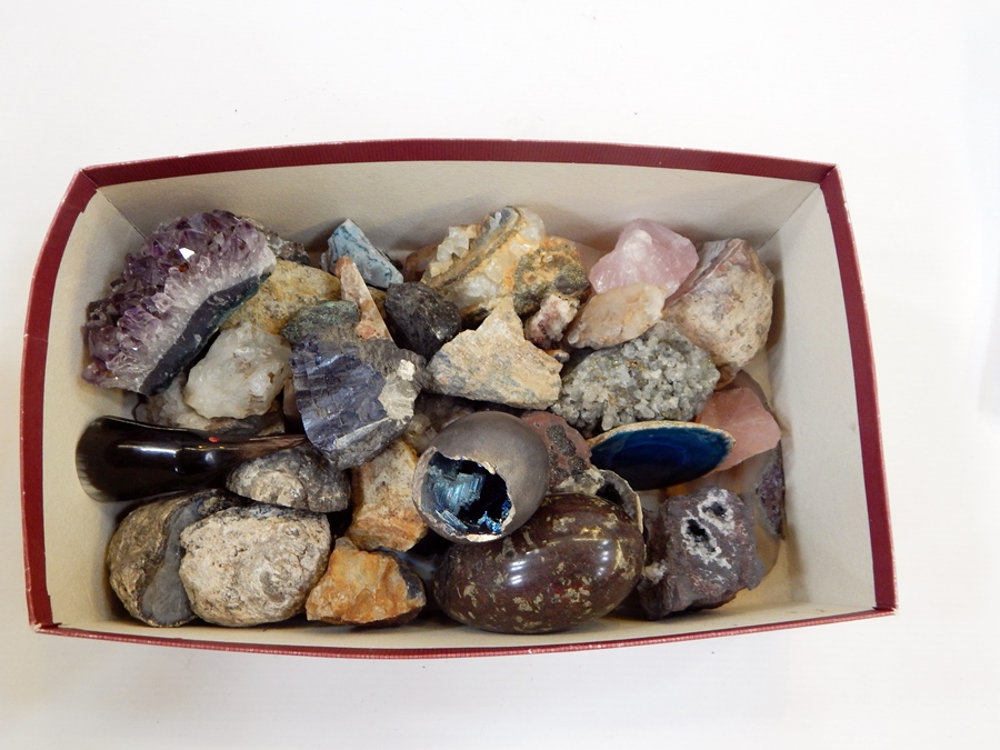 A collection of crystals and stones including amethyst,