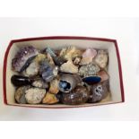 A collection of crystals and stones including amethyst,