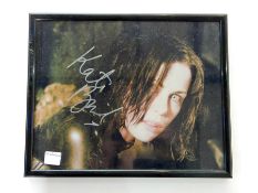 A signed Kate Beckinsale photograph, Peter Pracownik, Ian White with inscription "Ian,