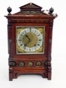 Victorian carved oak and copper-mounted mantel clock in architectural-style case with square brass