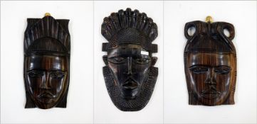 Three various African carved masks,