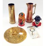 Large and small ammunition shells, a brass sundial, magnifying glass, Russian doll,