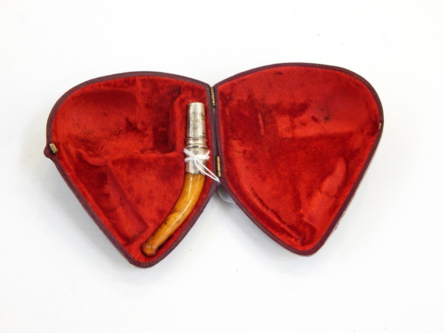 Silver-mounted amber pipe mouthpiece (bowl missing), two-section pipe,
