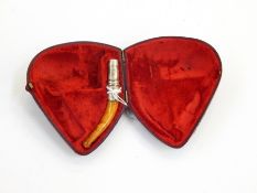 Silver-mounted amber pipe mouthpiece (bowl missing), two-section pipe,