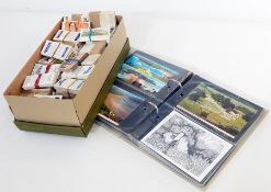 Two boxes and an album of topographical and other postcards,